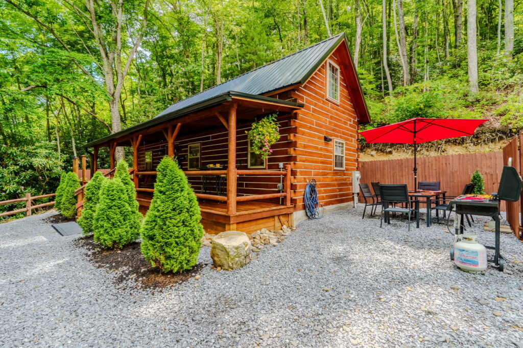 Cabin B exterior with red umbrella in Elizabethton, Tennessee