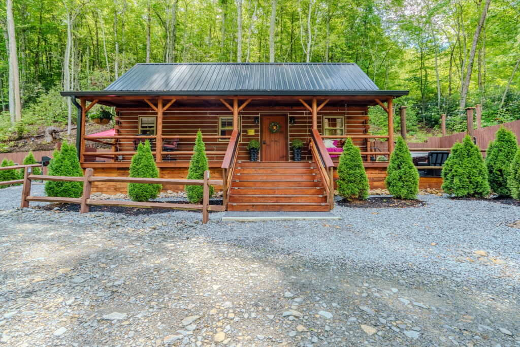 Two private log cabins in the trees at Monarch Mountain Cabins, Elizabethton