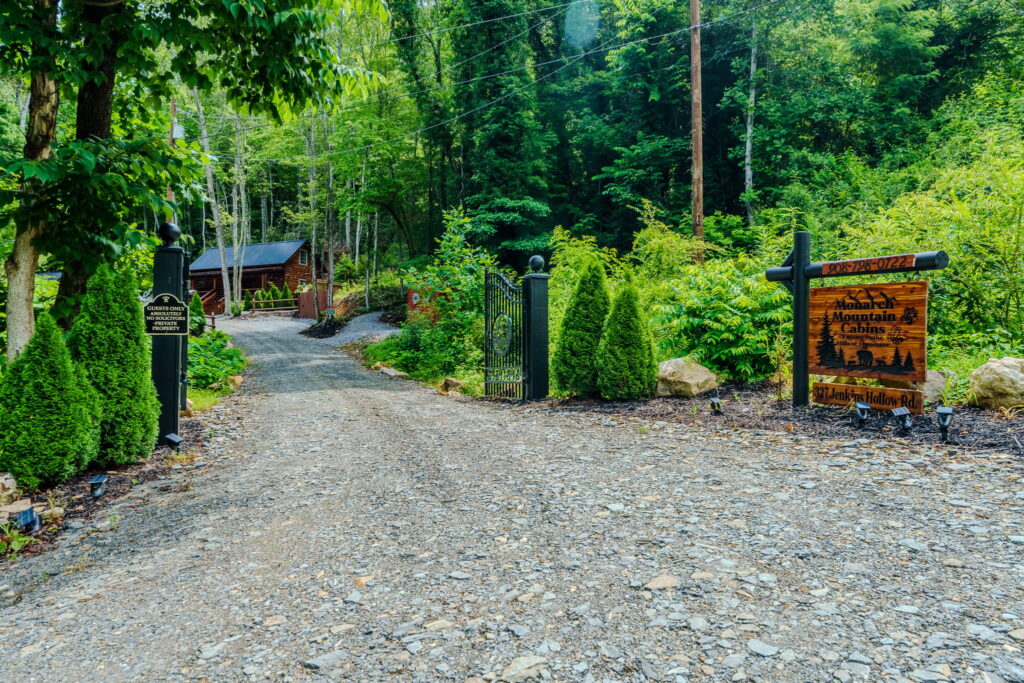 Wooded entry drive to Monarch Mountain Cabins in Elizabethton, Tennessee