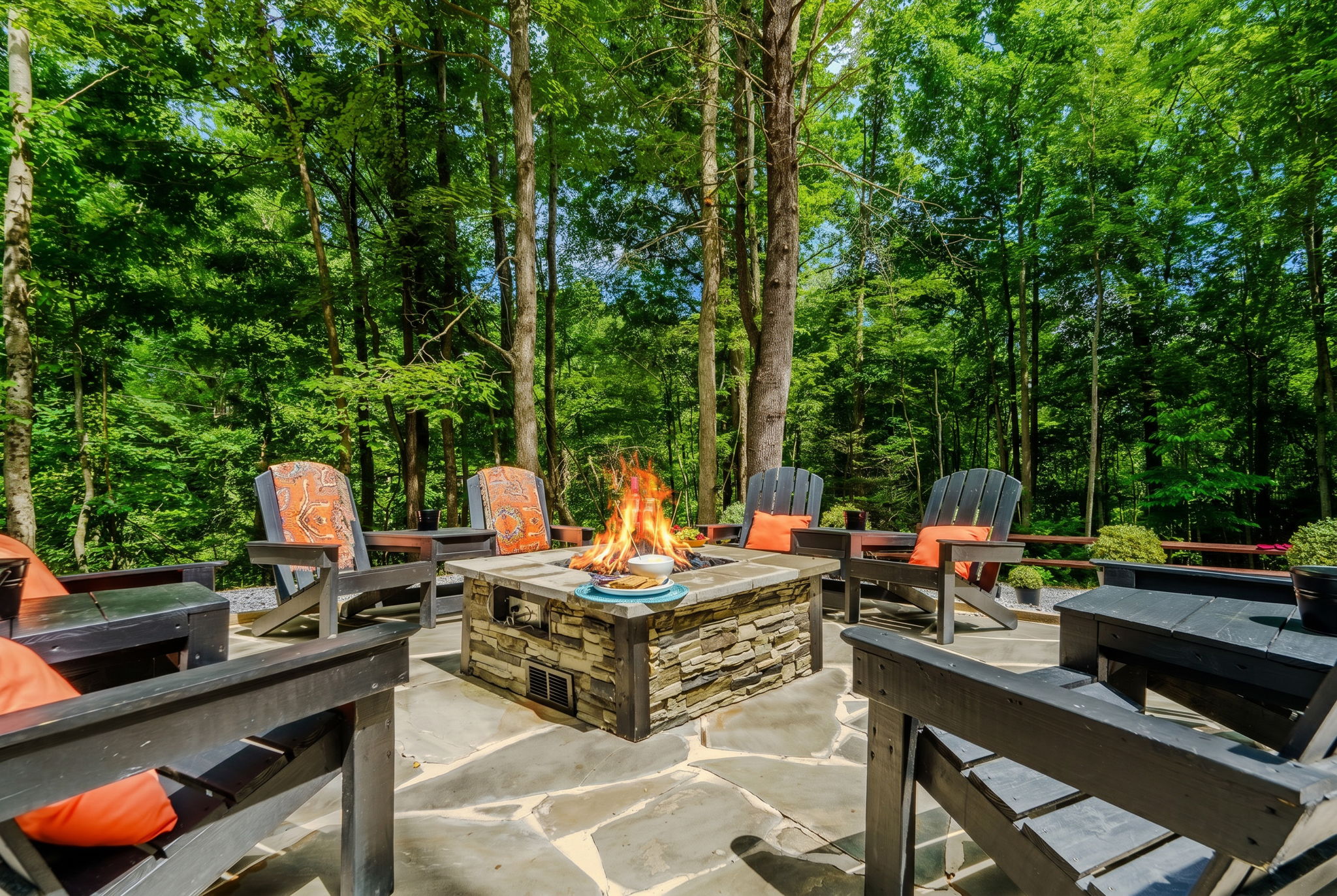 Gas firepit and Adirondack chairs at Monarch Mountain Cabins in Elizabethton, Tennessee